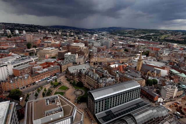 The view from the top of Sheffield's City Lofts St Paul's apartments, the city's tallest building. As clouds roll in from the north west, this view takes in the Peace Gardens (foreground) next to the town hall. Picture  Chris Lawton.