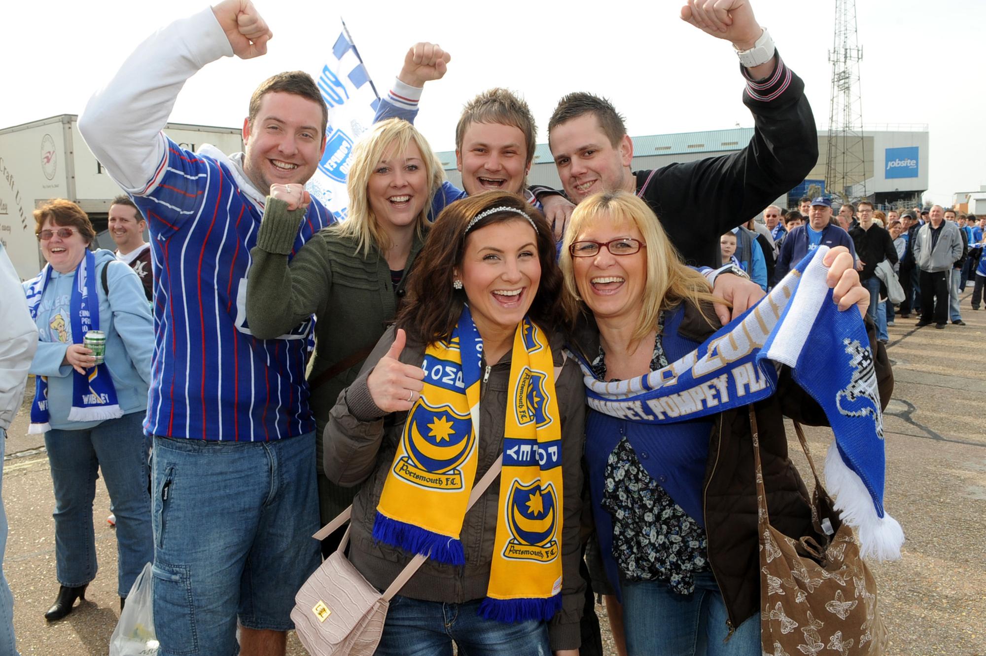 Chris Turner, Zoe Smith, Luke Swallow, Darren Good, and front Jackie Swallow and her daughter Jasmine board the bus for Wembley at Fratton Park..