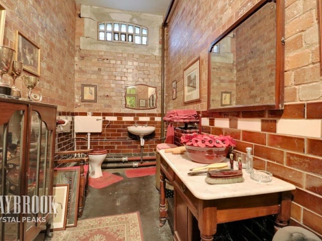 With a WC and sink, this former cell has become a practical space.