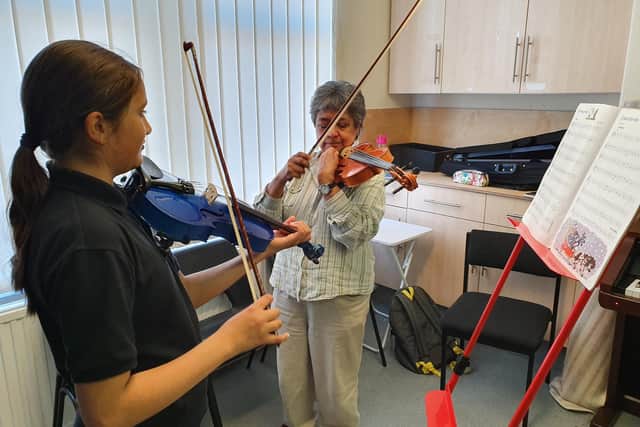The school offers training in multiple instruments, including violin, in Woodseats.