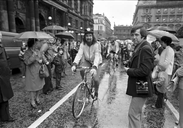 Scottish entertainer Billy Connolly leaves Glasgow on a sponsored cycle ride to Inverness in August 1980. Billy sets off from a rain-soaked George Square.