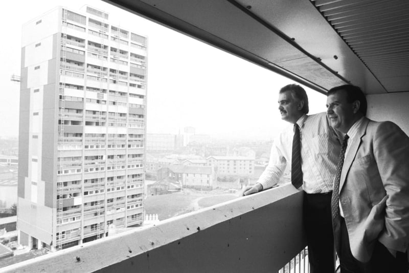 Colin Bellett (right) and Gleeson's John McEwan enjoy the view from the newly-refurbished Persevere Court tower block in Leith, September 1989. Other tower block is Citadel Court.