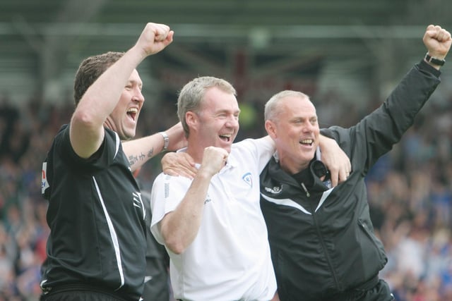 Mark Crossley, John Sheridan and Tommy Wright celebrate Chesterfield's second goal against Gillingham to secure the title.