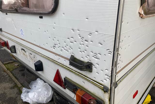 A caravan damaged by a shotgun discharge on Castledale Croft in Sheffield.