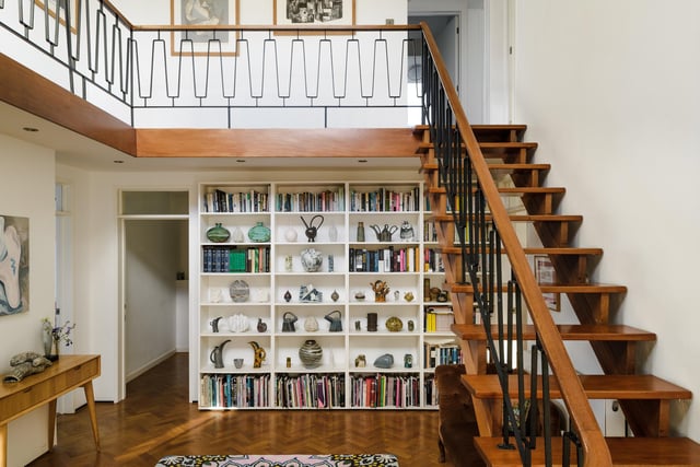 The internal living space extends approximately 3,690 square feet across three stories, which an abundance of natural light and views across the landscape form each level. This snug library sits nestled on the landing of the ground floor, providing a wonderful chill out space.