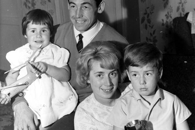 Tinsley born England World Cup Winning Goalkeeper Gordon Banks, Wife Ursula, children Wendy aged 3 and Robert aged 8 with his Gold Replica of the World Cup, taken at Gordon's parents home at Hill Top Farm, Catcliffe. July 30 1966