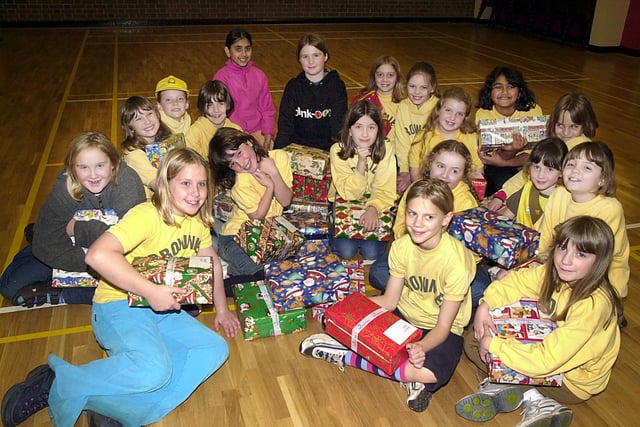 Members of the 20th St Andrews Brownie Pack with some of the Shoe Boxes they have prepared for Eastern European children for Christmas in 2002