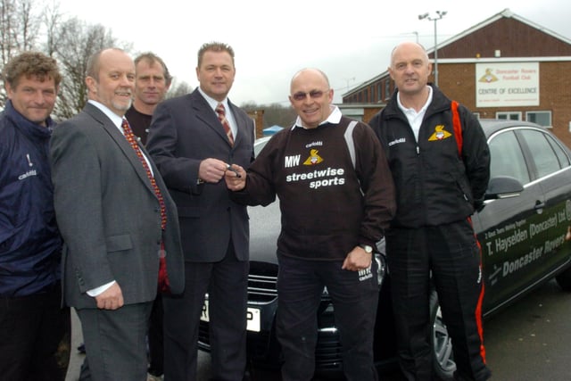 Hayseldens Doncaster District presented Doncaster Rovers with 5 VW cars at their training ground in Doncaster in 2006. L-R= Mickey Lewis(1st team coach) Steve Wragg (Fleet sales manager), Paul Wilson (Youth Worker Manager), Kev Laughton (General Manager of Hayseldens) Mickey Walker (Assistant Manager(DR)) and Barrie Windle (Physio)