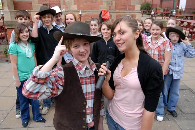 Children from Westovians were pictured singing and dancing in King Street in this performance from their showing of Oklahoma. Remember it?