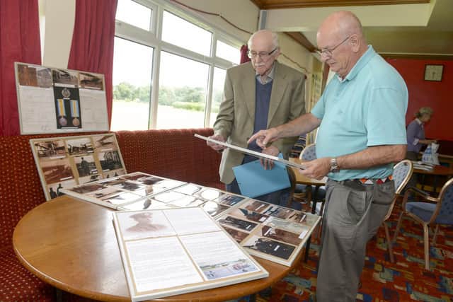 RFC Airfield at Sheffield transport Social Club, Meadowhead.
Frank Donnelly and John Grayson look over old pictures of the airfield taken by John's father William