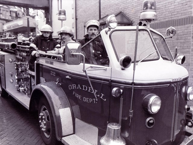 On the Beaujolais trail to France is this fire engine from the USA in Orchard Square, Sheffield. Pictured left to right are firemen Ian Short, Stuart Hobson and Tony Hunter, October 7, 1989