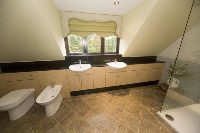 The master bedroom en suite features twin vanity wash basins.