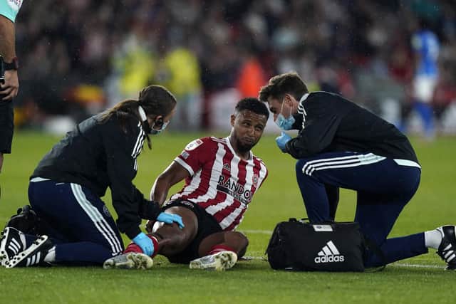 Sheffield, England, 7th August 2021. Lys Mousset of Sheffield Utd goes off injured during the Sky Bet Championship match at Bramall Lane, Sheffield. Picture credit should read: Andrew Yates / Sportimage