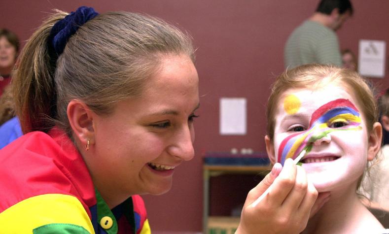 Joanne Varndell, aged 20 painting the face of six-year-old Amy Moss in 2000 at a Summer Fayre in Rossington.