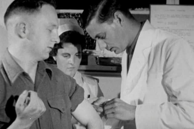 A US Air Force serviceman getting a flu jab during the 1957 film