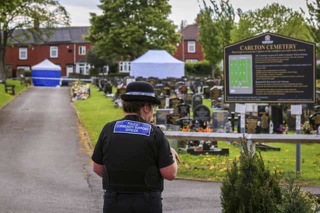 Police officers were today stood guard at Carlton Cemetery, Barnsley,  after it was discovered that a grave had been partially dug up. Photos from today (Thurs) showed a large section of graves at the cemetery cordoned off to the public, with two forensic tents set up at the site.