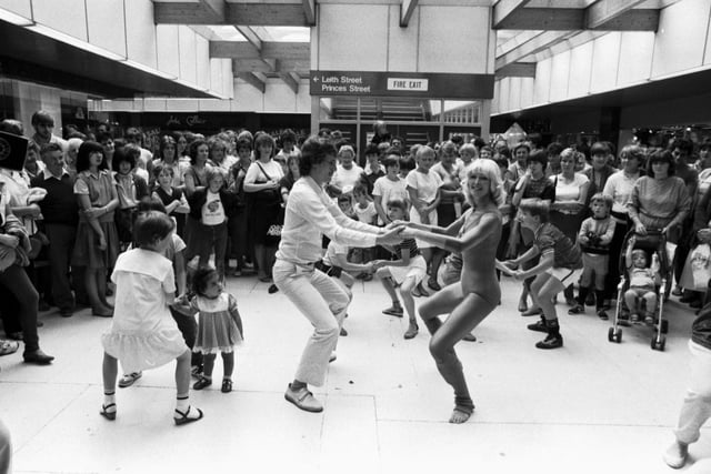 Fitness expert Diana Moran (the 'Green Goddess') takes an impromtu keep-fit class in the St James centre Edinburgh, August 1983.