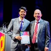 Dr Raju (left) receives his award from British Society of Gastroenterology President Professor Andre