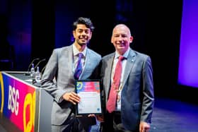 Dr Raju (left) receives his award from British Society of Gastroenterology President Professor Andre