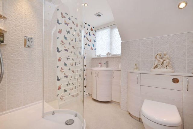 The first floor shower room has a shower enclosure, tasteful tiling, a modern wash basin and a WC.