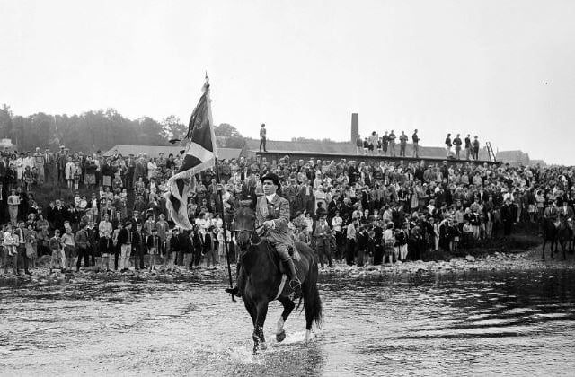 Selkirk Common Riding, June 1963. Mr Ian McCudeen, with the standard banner, crosses the Ettrick.
