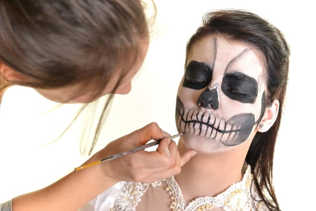 This spooky look can be created with black eyeliner, eyeshadow and foundation. Make your foundation pale by adding talc to it (or use white face paint, if you have it) then create the skull with heavy black eye shadow around the eyes and the tip of your nose. Add the intricate lines of the mouth using an eyeliner pencil.