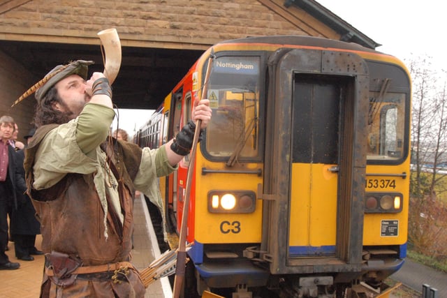 Trains began running on Sundays from Mansfield station in December 2008 - the town previously had the unenviable reputation of being the largest in the UK not to have Sunday rail services. 'Robin Hood' is pictured signalling the departure of the first train to leave on the Robin Hood Line to Nottingham.
