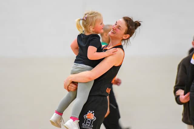 Sarah Cooney with her daughter after making her second return to the WBBL team