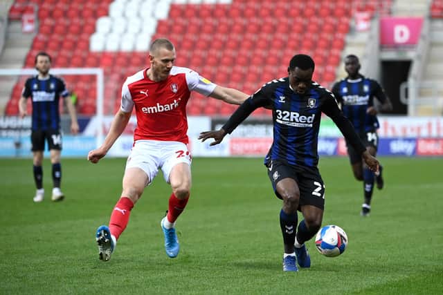 Marc Bola of Middlesbrough battles for possession with Michael Smith of Rotherham United (photo by Ross Kinnaird/Getty Images).