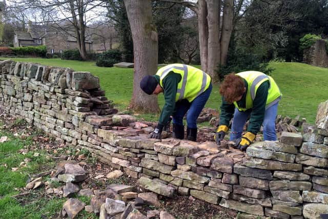 Beauchief Environment Group carrying out a drystone wall repair near Beauchief Abbey