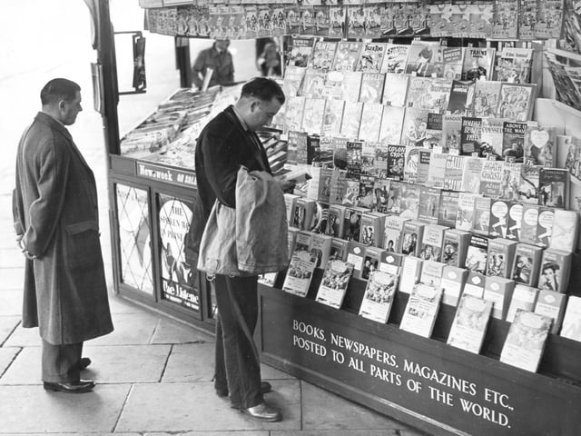 Newspapers, books and magazines for sale at this stall in Sheffield, on December 9, 1953