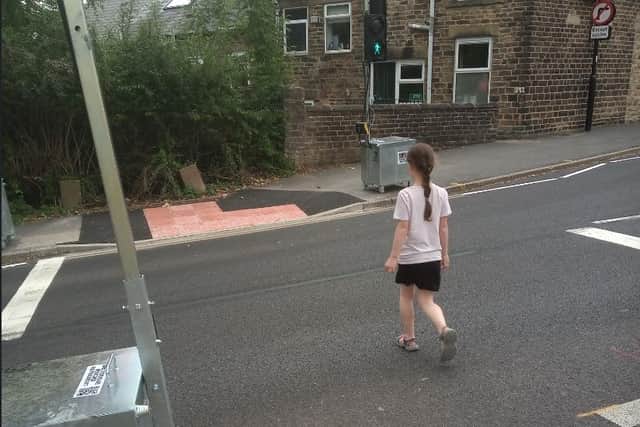 Supporters of a controversial ‘active neighbourhood’ scheme in Sheffield say the project is making their children safer. PIctured is a child on a newly installed crossing on Heavygate Road, Crookes.