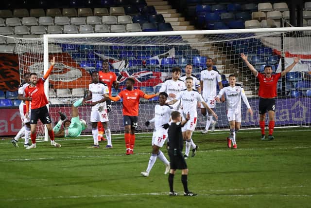 Luton Town players react after Referee Dean Whitestone disallows a goal during the Sky Bet Championship match between Luton and Rotherham United at Kenilworth Road. Tim Goode/PA Wire.