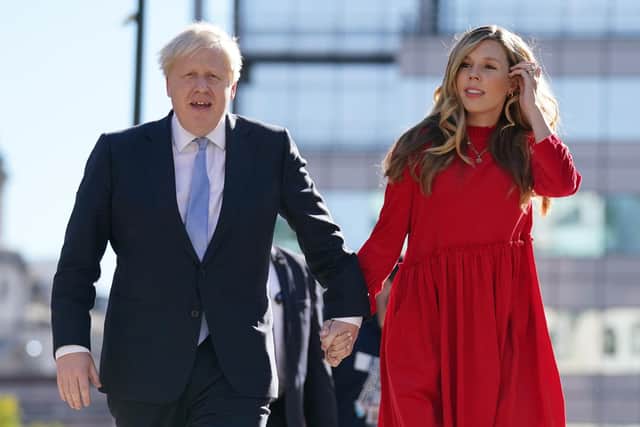 Prime Minister Boris Johnson with his wife Carrie. Boris Johnson's wife Carrie has given birth to her second child with the Prime Minister after a tumultuous 24 hours for Downing Street. Issue date: Thursday December 9, 2021.