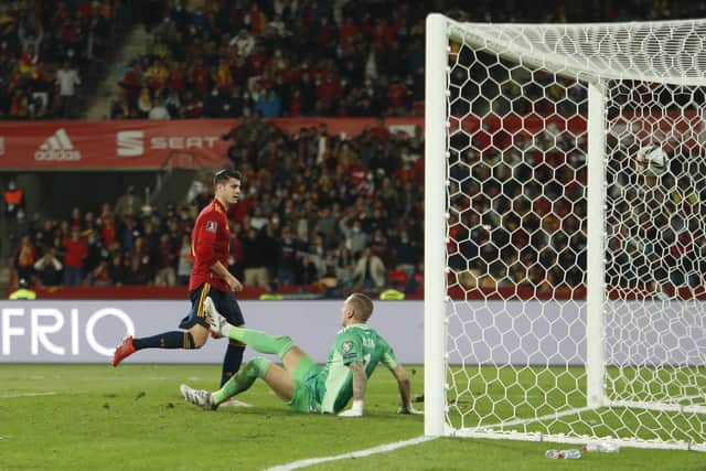 Sheffield United's Robin Olsen is left stranded as Spain's Alvaro Morata scores the winner against Sweden (AP Photo/Angel Fernandez)