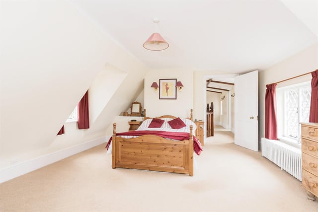 The brightly lit and elegant master bedroom offers double aspect windows and an en-suite.