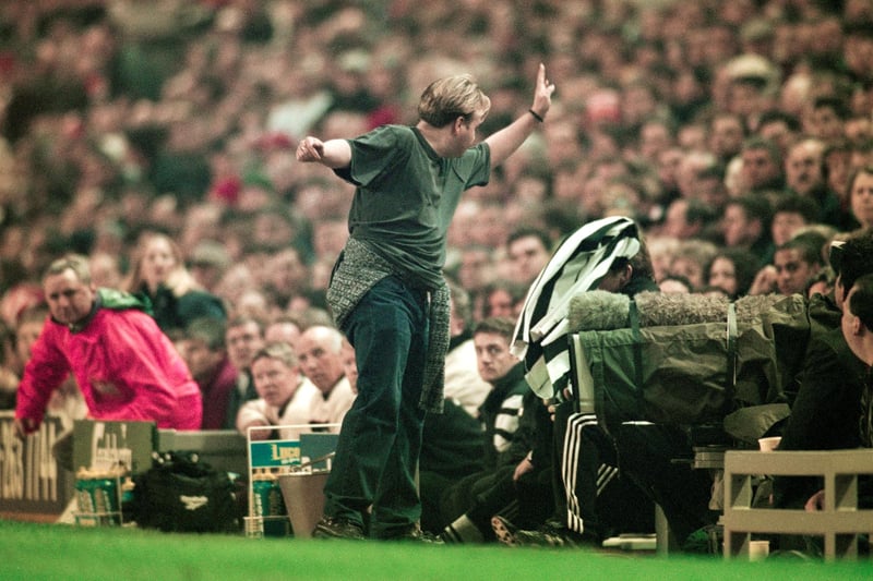 A Newcastle fan throws his shirt at manager Kenny Dalglish with the garment landing on the Scots head as Newcastle fall 3-0 down in the first half of the FA Carling Premiership match between Liverpool and Newcastle United at Anfield