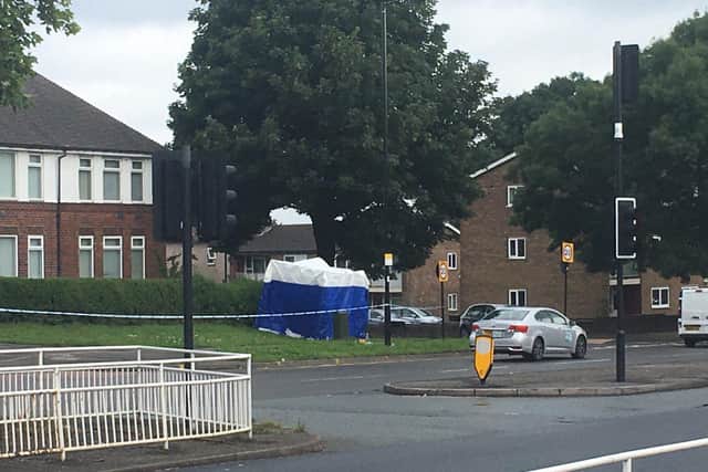 A police tent has been put up at the crime scene beside Prince of Wales Road in Sheffield