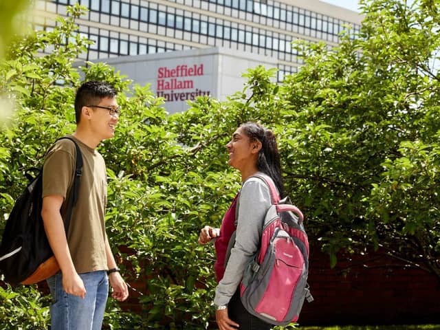 Students chatting outside Sheffield Hallam University building