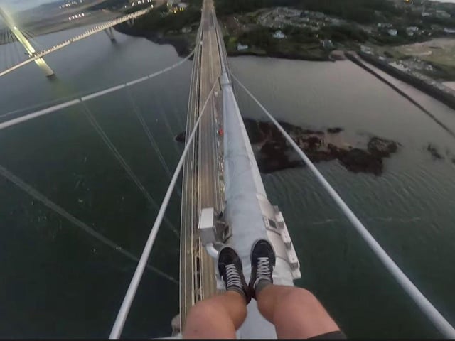 The mile-and-a-half long bridge is the latest in a long list of structures scaled by Adam and his friends.
