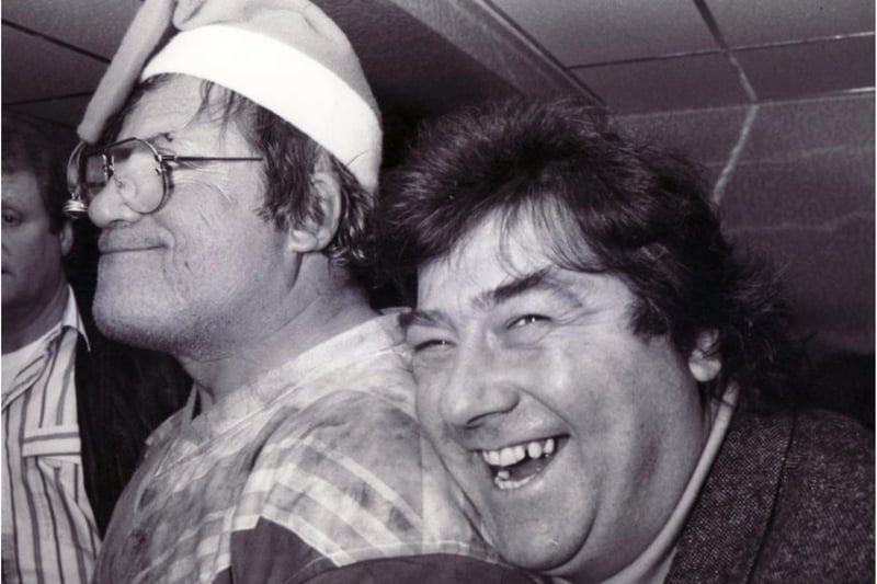 Hellraising film star Oliver Reed (left) and TV star Tony Barton at the club in 1990.