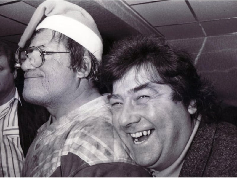 Hellraising film star Oliver Reed (left) and TV star Tony Barton at the club in 1990.