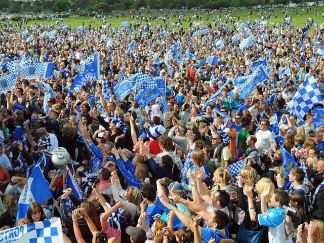 Massive crowds welcomed the Pompey players as they arrived at Southsea Common. Picture: Malcolm Wells 082236-5621