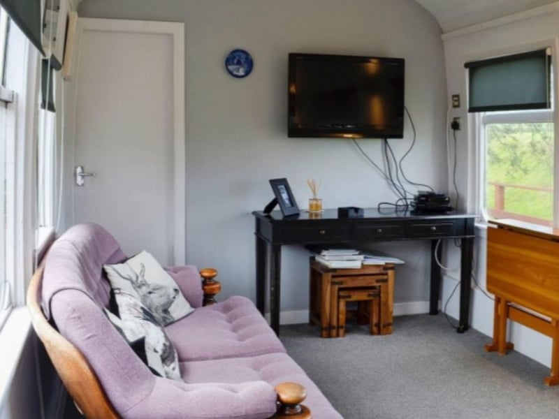 Sit back on a comfy couch in the living area.