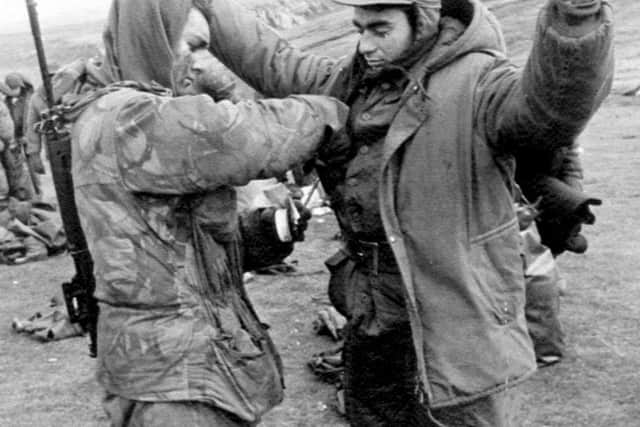 17/06/1982 of a Royal Marine of 40 Commando searching an Argentine prisoner at Port Howard on West Falkland, following the surrender of the Argentinian armed forces in the Falklands war. The 20th anniversary of the invasion of the Falklands by Argentine forces will be on April 2nd, 2002. PA Photo.
