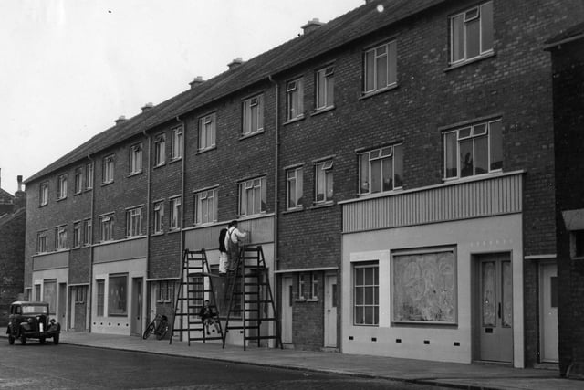 New shops, with self contained flats above, are pictured in High Street in 1955.