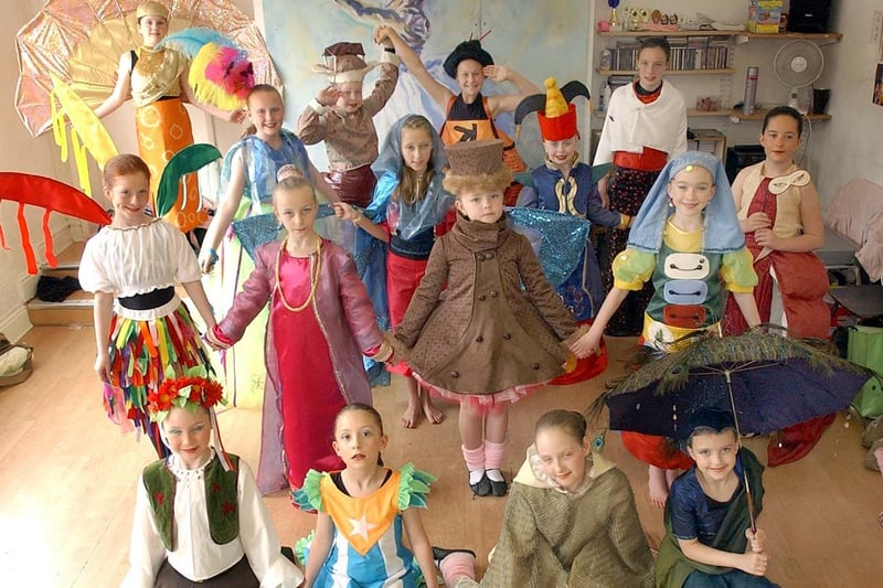 These students at the Curtain Up Theatre School paid tribute to the Olympics with these national costumes in 2004.