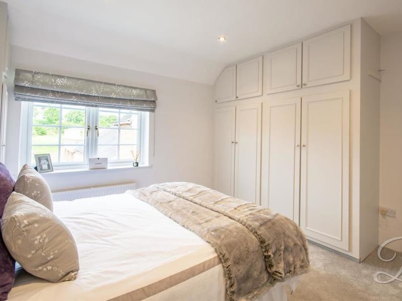 The property's third bedroom is also first class. Again it boasts fitted wardrobes, carpet and central heating, plus a window and access to en suite facilities.