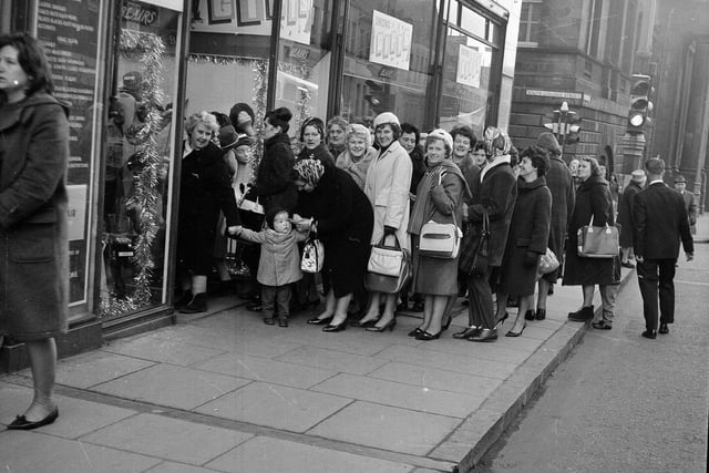 A bus party of Fifers arrive at Blair's, on Nicolson Street, to do their Christmas shopping in December 1964.