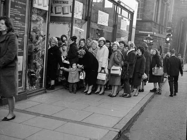 A bus party of Fifers arrive at Blair's, on Nicolson Street, to do their Christmas shopping in December 1964.
